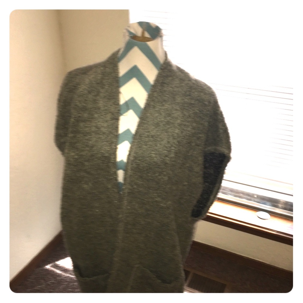 Sleeveless sweater. Very clean.